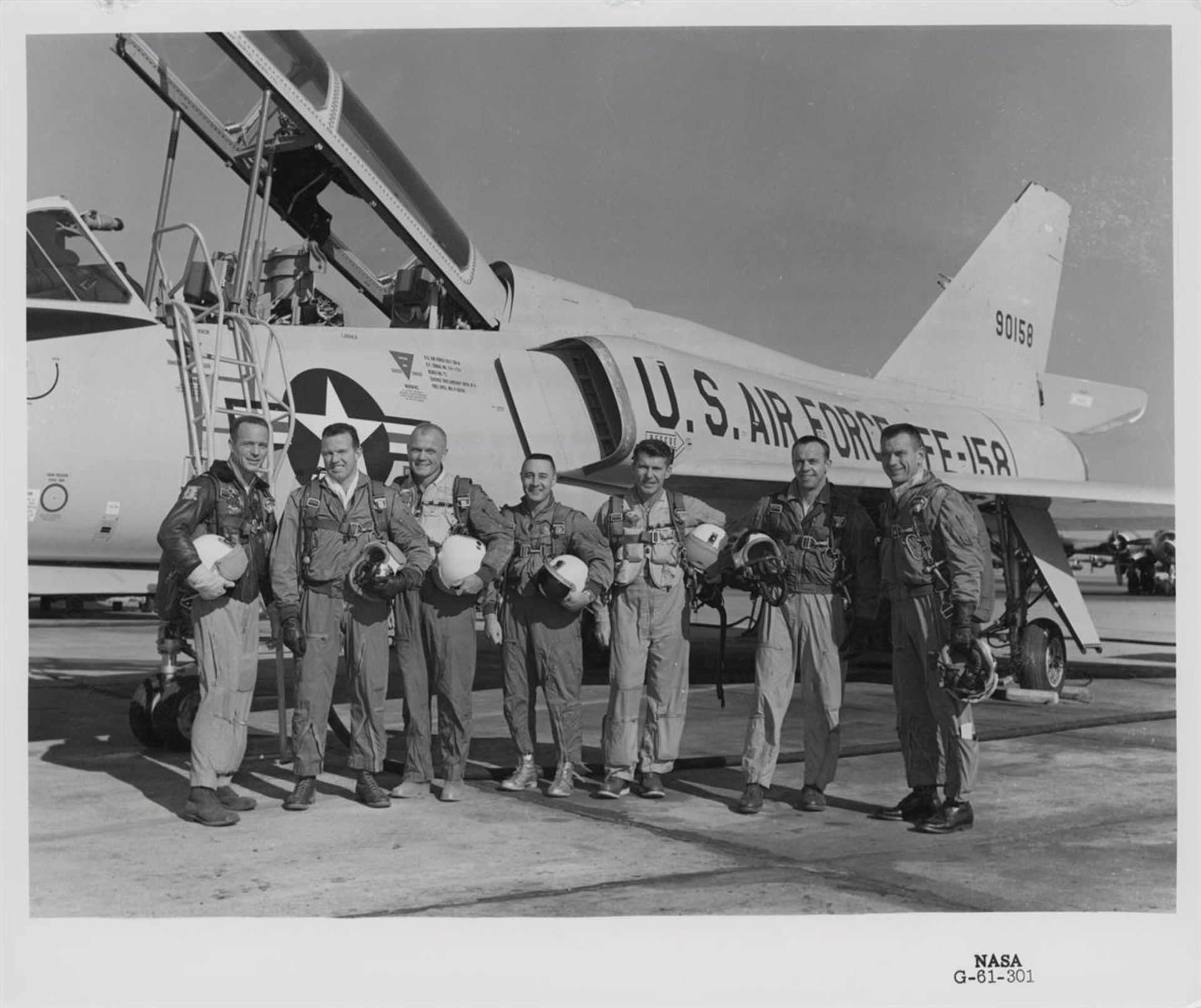 The Mercury Seven group with test pilot aircraft and Big Joe rocket (2 views), 1960- 20 January 1961 - Image 2 of 5