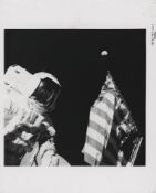 Harrison Schmitt with the Earth above the American flag Apollo 17, 7-19 December 1972, EVA 1