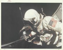 Buzz Aldrin attaches Mauer camera to the spacecraft during EVA, Gemini 12, 11-15 November 1966