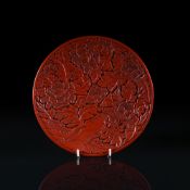 A Chinese lacquered 'Peony' plate