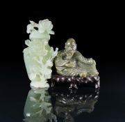 A Chinese green jade figure of a seated man