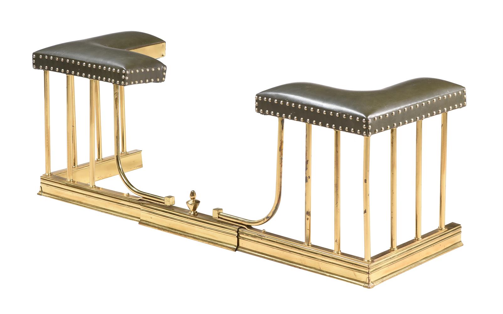 A GREEN UPHOLSTERED EXTENDING CLUB FENDER