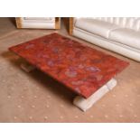 A RED JASPER, RESIN, AND CARVED STONE LOW CENTRE TABLE