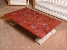 A RED JASPER, RESIN, AND CARVED STONE LOW CENTRE TABLE