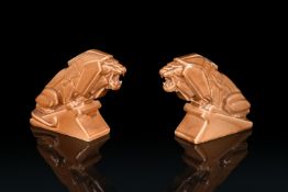 PERCY METCALFE, FOR ASHTEAD POTTERY, A PAIR OF ART DECO GLAZED EARTHENWARE 'LIONS OF INDUSTRY'