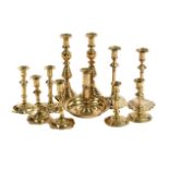 A COLLECTION OF FIVE VARIOUS PAIRS OF BRASS CANDLESTICKS