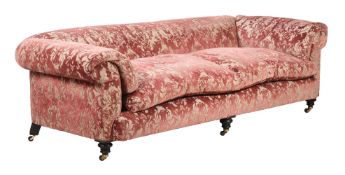 A MAHOGANY AND UPHOLSTERED SOFA IN VICTORIAN TASTE