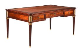 A FRENCH MAHOGANY AND GILT METAL WRITING TABLE IN EMPIRE STYLE