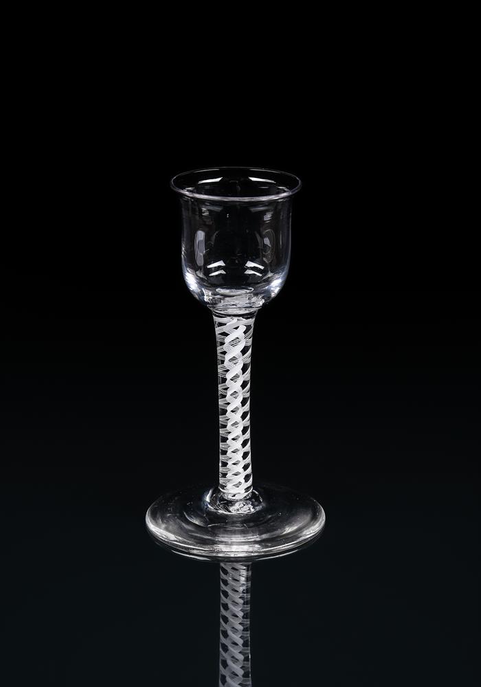 A GROUP OF FOUR OPAQUE-TWIST DRINKING GLASSES