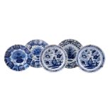 A GROUP OF FIVE VARIOUS DUTCH DELFT BLUE AND WHITE CHARGERS