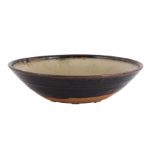 λ RICHARD BATTERHAM (BRITISH 1936-2021), AN ASH GREEN AND BROWN GLAZED STONEWARE BOWL