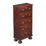 A MAHOGANY CHEST OF DRAWERS