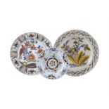 A GROUP OF THREE VARIOUS DELFT POLYCHROME PLATES