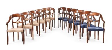 A SET OF TWELVE MAHOGANY AND BEECH ARMCHAIRS IN EMPIRE STYLE