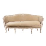 A WHITE PAINTED AND UPHOLSTERED SOFA IN FRENCH TASTE
