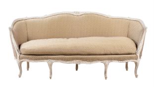 A WHITE PAINTED AND UPHOLSTERED SOFA IN FRENCH TASTE