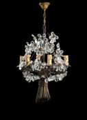 A MODERN METAL AND CRYSTAL HUNG CHANDELIER ATTRIBUTED TO MAISON BAGUES