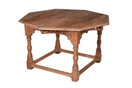 A FRENCH CARVED CHESTNUT AND OAK EXTENDABLE CENTRE TABLE, IN THE GOTHIC MANNERBY J EMERY & RAGOT