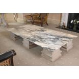 A LARGE VARIEGATED MARBLE LOW CENTRE TABLE