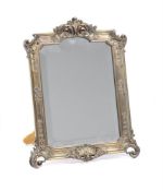 GUSTAVE KELLER, PAIRS, A SILVERED METAL EASEL DRESSING MIRROR