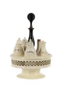 AN ENGLISH CREAMWARE EXPORT CRUET SET FOR THE CENTRAL EUROPEAN MARKET