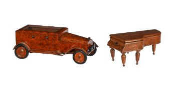 A BURR WOOD CIGARETTE BOX IN THE FORM OF A MOTOR CAR