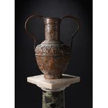 AN INDIAN COPPER TWIN HANDLED AMPHORA