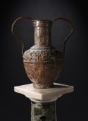 AN INDIAN COPPER TWIN HANDLED AMPHORA