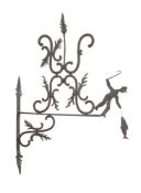 A WROUGHT IRON SHOP SIGN WITH FISHERMAN MOTIF