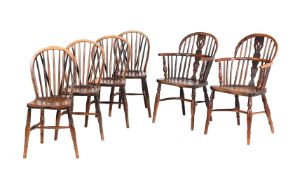 A PAIR OF MIXED WOOD WINDSOR ARMCHAIRS