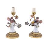A PAIR OF CONTINENTAL PORCELAIN AND GILT METAL MOUNTED TABLE LAMPS