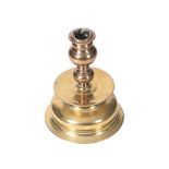 A BRASS AND COPPER CANDLESTICK