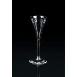 A PLAIN-STEMMED TOASTING GLASS