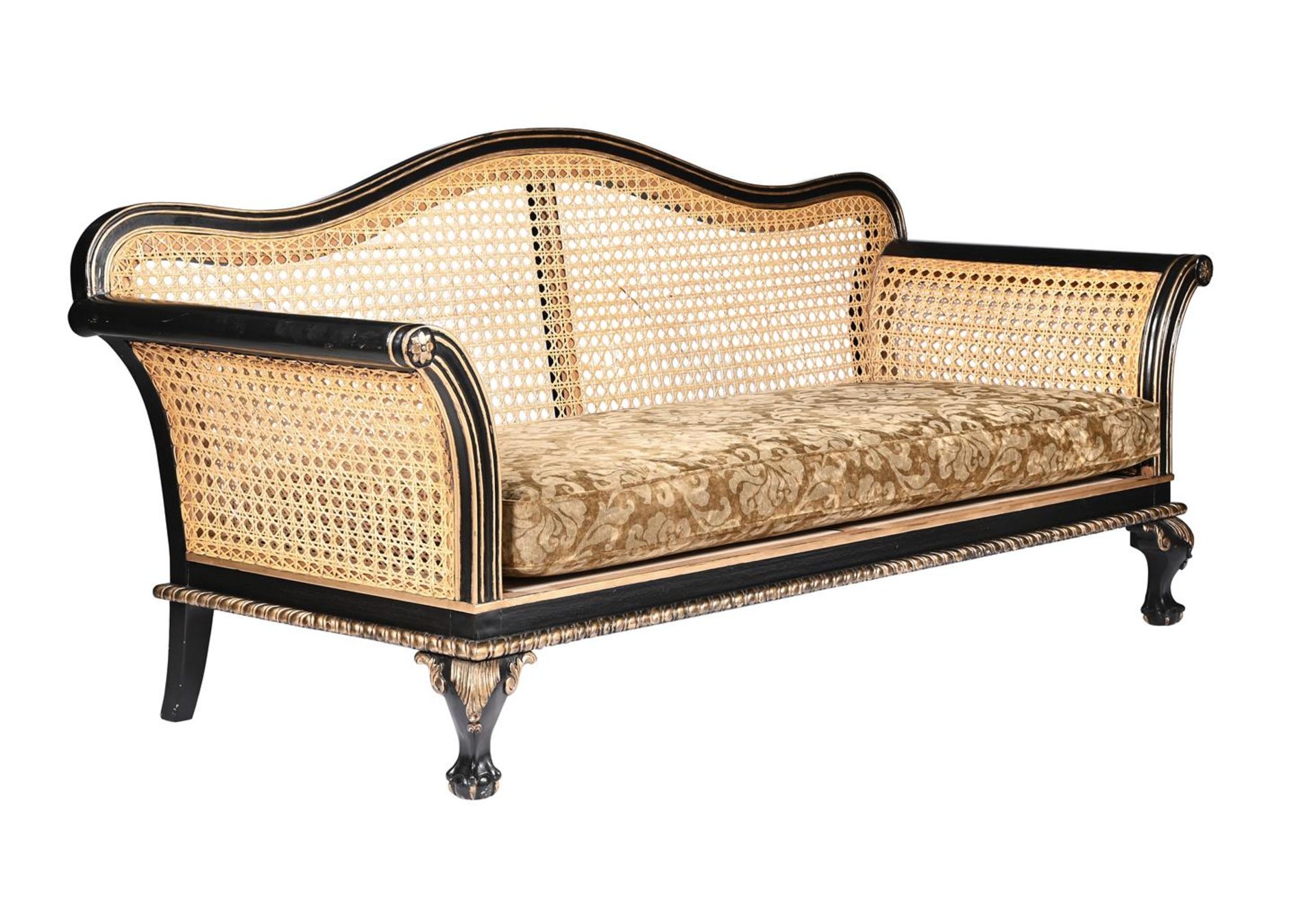 AN EBONISED, PARCEL GILT AND CANED SOFA