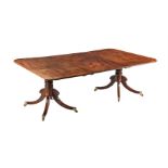 A REGENCY MAHOGANY TWIN PEDESTAL DINING TABLE