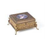 A FRENCH GILT-METAL BOX AND HINGED COVER WITH PORCELAIN PORTRAIT PANEL INSERT OF LIMOGES TYPE