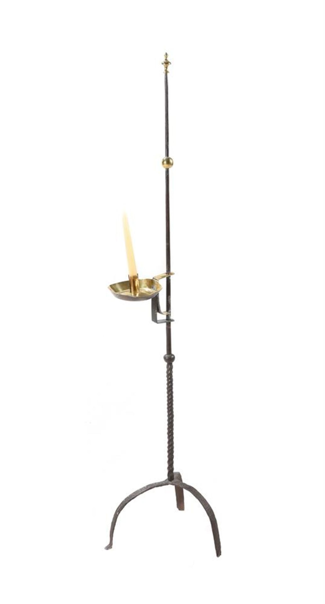 A BRASS AND STEEL CANDLE OR RUSH STAND