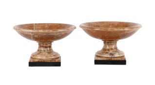 A NEAR PAIR OF CARVED ALABASTER TAZZAE