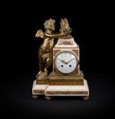 A FRENCH GILT METAL AND MARBLE MANTEL CLOCK IN LOUIS XVI STYLE