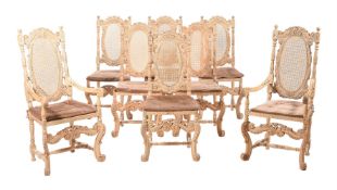 A SET OF EIGHT CARVED OAK CHAIRS