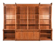 A VICTORIAN OR EDWARDIAN PITCH PINE BREAKFRONT BOOKCASE