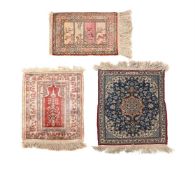 A COLLECTION OF THREE SMALL PERSIAN RUGS