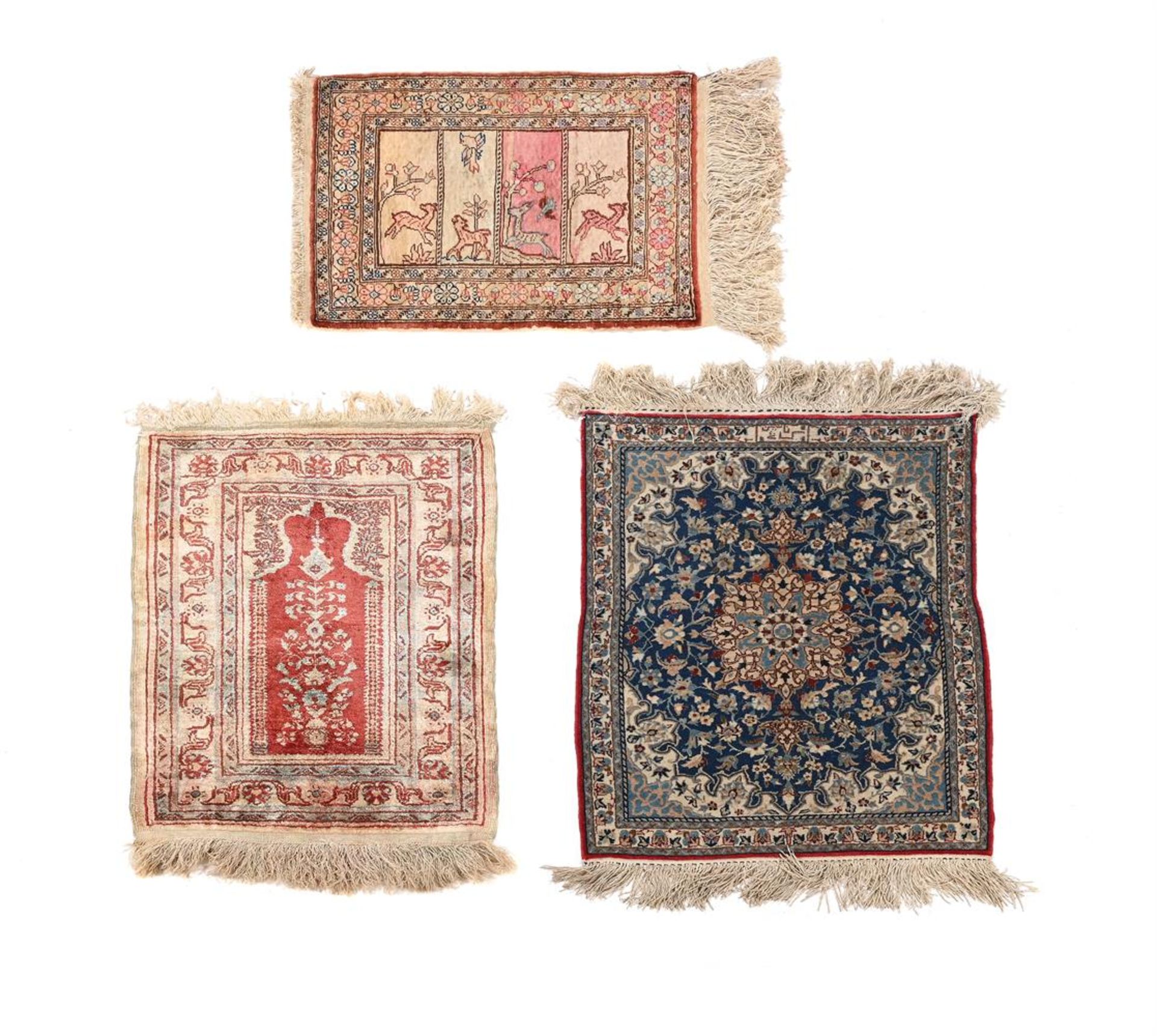 A COLLECTION OF THREE SMALL PERSIAN RUGS
