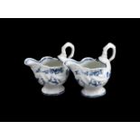 A PAIR OF WORCESTER BLUE AND WHITE DOLPHIN EWERS