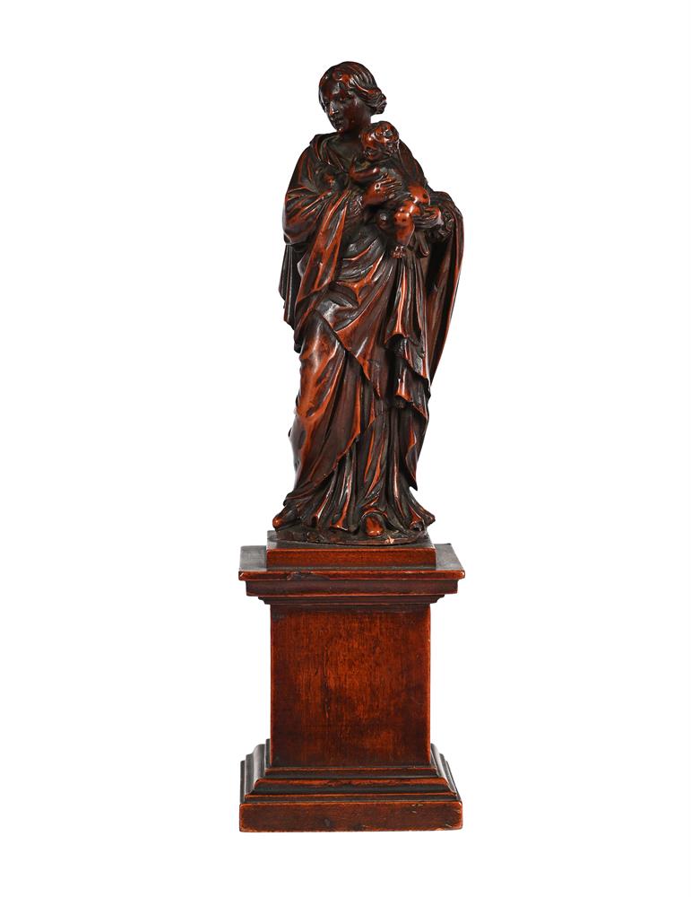 AN ITALIAN CARVED BOXWOOD FIGURE OF THE MADONNA AND CHILD