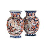 A PAIR OF JAPANESE IMARI OVAL SECTION VASES