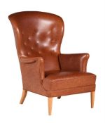 AFTER FRITS HENNINGSEN, A BEECH AND LEATHER UPHOLSTERED WINGBACK CHAIR