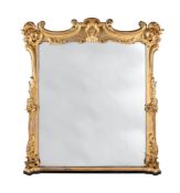 AN EARLY VICTORIAN CARVED GILTWOOD OVERMANTEL WALL MIRROR