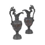 A PAIR OF BRONZED EWERS IN THE NEO-CLASSICAL TASTE