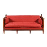 A FRENCH EMPIRE MAHOGANY AND BRASS MOUNTED SOFA